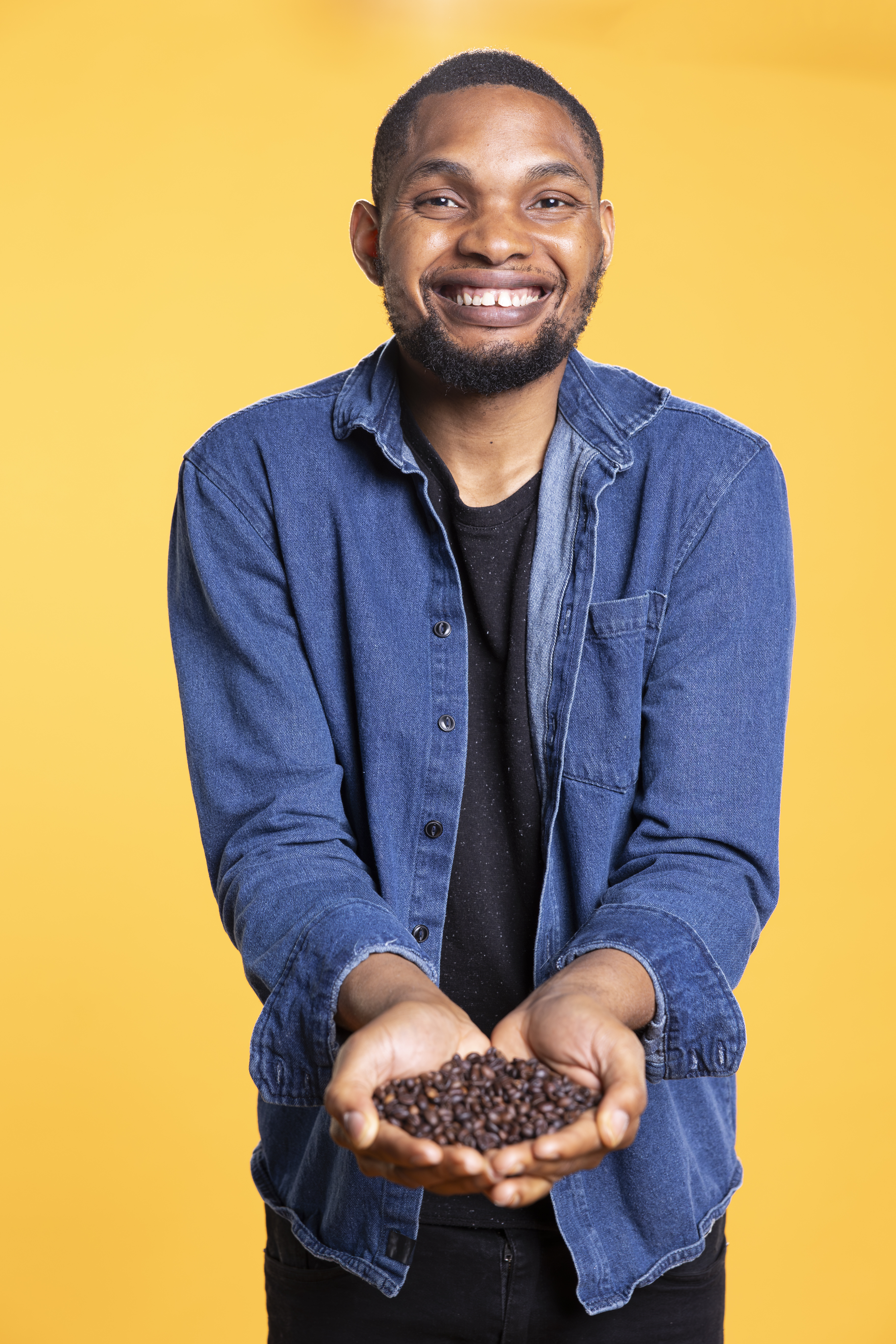 african-american-man-smiling-and-holding-coffee-be-2025-02-19-23-34-22-utc